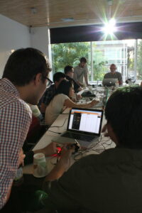 Two people looking at a computer screen at a workshop