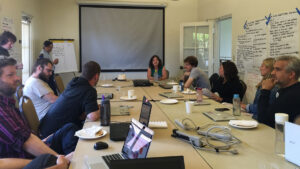 people sitting around a table at a meeting