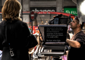 Reporter using a teleprompter