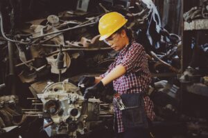 A car mechanic working on an engine