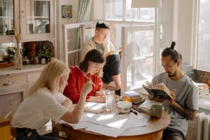 A group of students quietly working on a study project together.