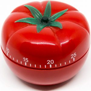 A kitchen timer that looks like a tomato.