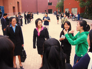 group of young women, many in business suits 