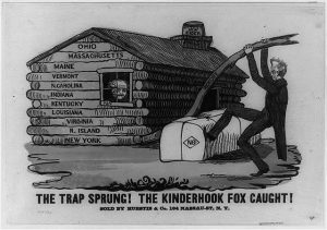 A print of a parody ad from the Log Cabin Campaign era. The ad features a log cabin and a man is seen peering out a window from inside. Outside of the cabin, Andrew Jackson is seen pulling on a lever near a bale of hay. The type reads, "THE TRAP SPRUNG! THE KINDERHOOK FOX CAUGHT!"