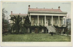 A photo of an old plantation villa in New Orleans, Louisiana. The extravagant house sits on a large plot of land. 