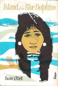 Cover of the first edition of the Island of the Blue Dolphins book, with an image of an Indigenous woman on the cover.