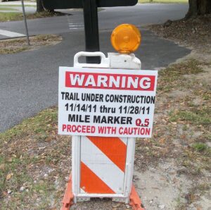 Sign warns "Trail Under Construction"