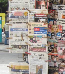 A newsstand with newspapers and magazines