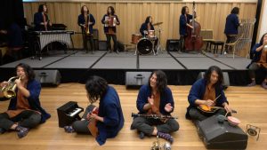 A person photoshopped into a picture such that he's playing all the instruments in the band