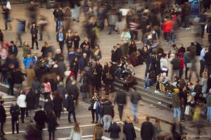 A crowd of people, with a slight blur effect