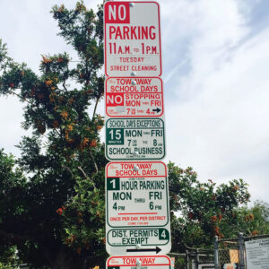 A confusing sign with a variety of rules about when one can and can't park here.