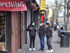 Three men wearing masks