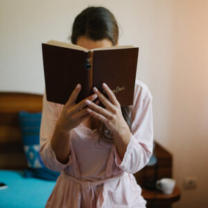 Woman standing and reading