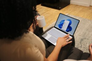 A person typing on a laptop