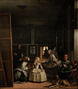 The painting Las Meninas: The person who stands in the middle is the Infanta Margarita Teresa of Austria (the princess, daughter of the king and queen). She has two maids of honour, one on each side of her, a chaperone, a bodyguard, two dwarfs and a dog. Velázquez has also painted himself, standing just behind the princess and her companions. He is standing at the artist’s easel. He has stopped painting for a moment and looks straight out at the viewer. At the back of the room is a mirror in which we can see the top halves of the bodies of the king and queen. This means that the king and queen are the viewers who are looking at the painting. (description from wikipedia)