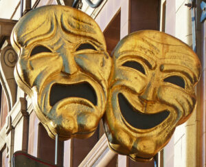 Gilded laughing and crying masks 