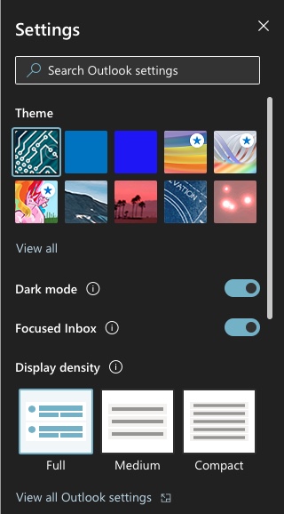 A screenshot of Outlook settings. Below the search bar and theme selections, there is a toggle switch allowing the user to turn on dark mode. 