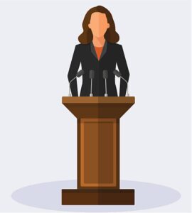 A clipart illustration of a woman standing in front of a podium with microphones
