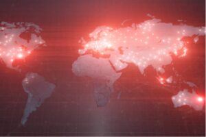 A world map showing bright red lights in various spots around the world