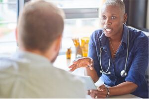 A doctor explaining something to someone else