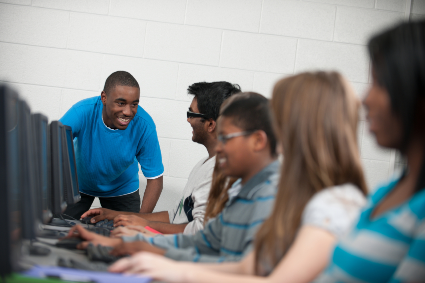 A diverse group of students using computers.