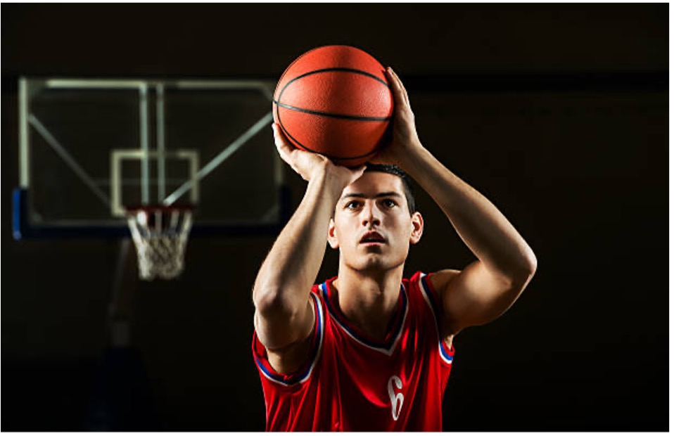 A basketball player about to take a shot.