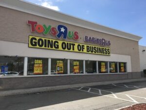 Toys R Us Store with signs in windows announcing "Going Out of Business"