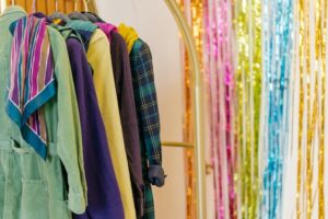 assorted coats hanging on a clothes rack