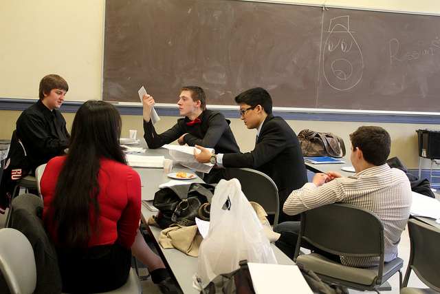 Five students studying in a classroom