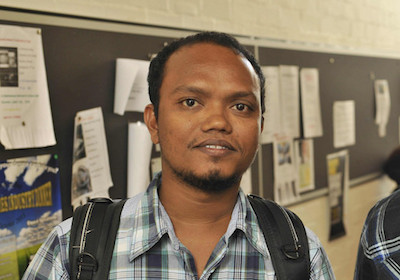 image of a young man wearing a backpack