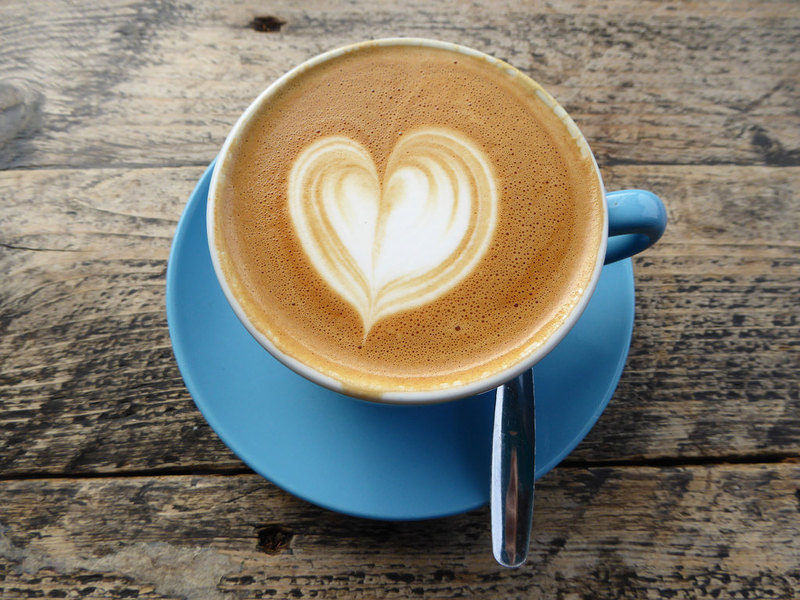 Coffee cup with heart shaped cream inside.