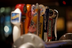 Local and craft beers on tap are half-off during happy hour at the bar.