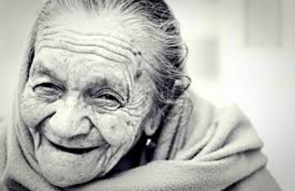 I love this lady's expression! Wrinkles, gray hair and a smile.