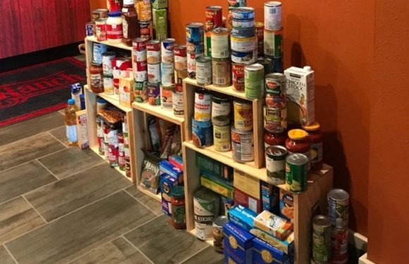 Stack of canned and boxed food donations.