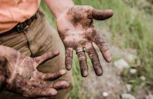 Mud covered hands