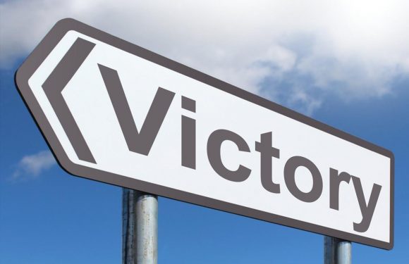 Street sign that says Victory