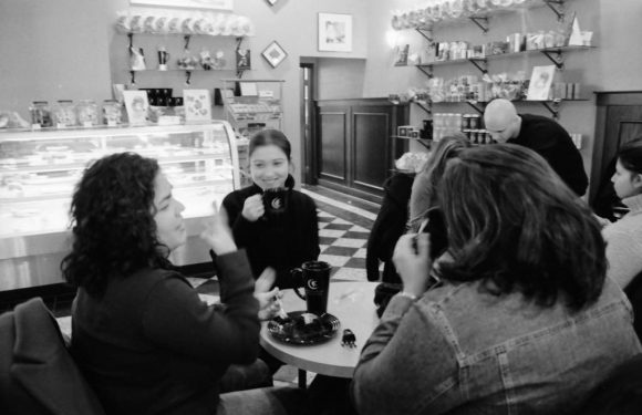 Friends have coffee in a cafe