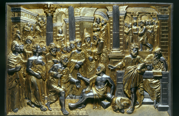 Carved gold image of bible story