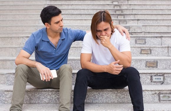 2 People Sitting on Steps, 1 supporting the other