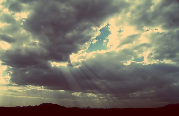 Sun beams shining through clouds