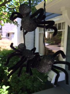 Finished tree spiders hanging from the trees to scare trick or treaters