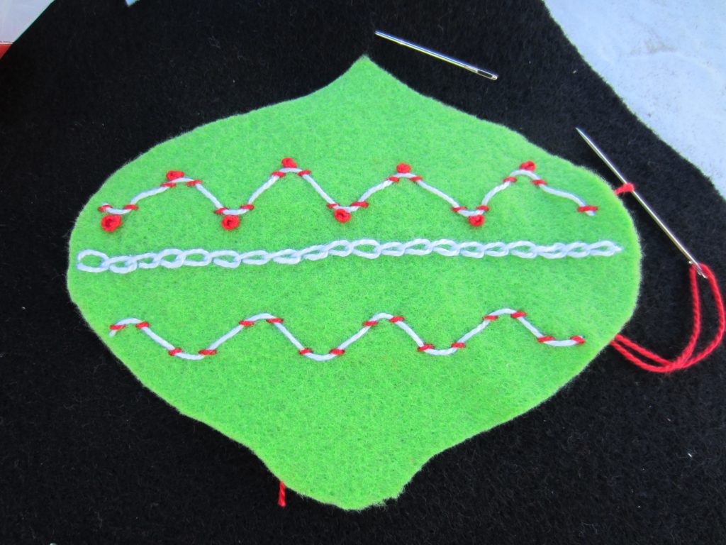 Added some French knots and a chain stitch