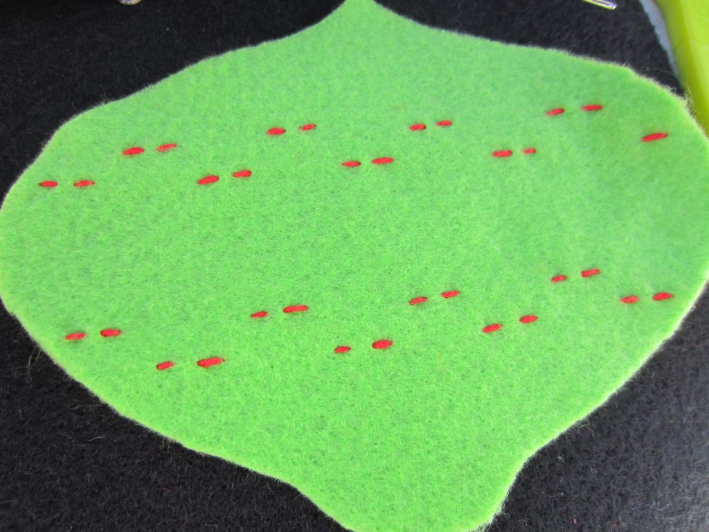 Adding some running stitches to a basic felt shap