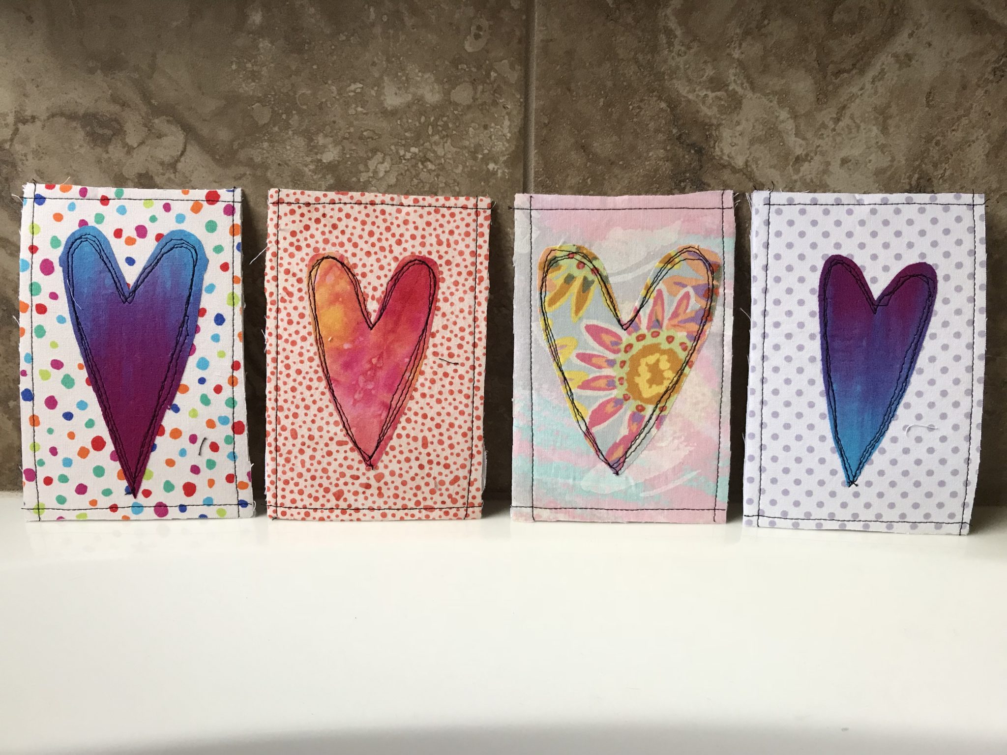 Four finished Valentine's postcards