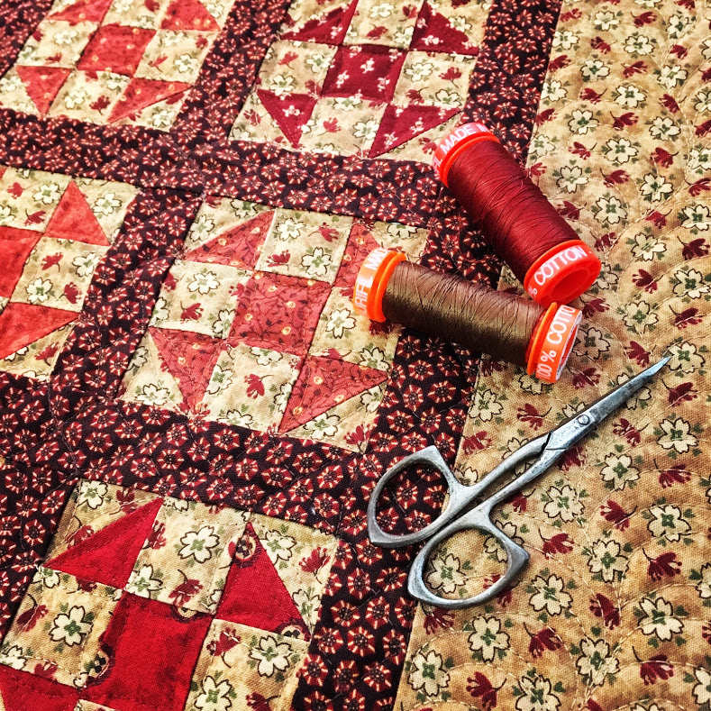 Leftover triangles made into a quilt
