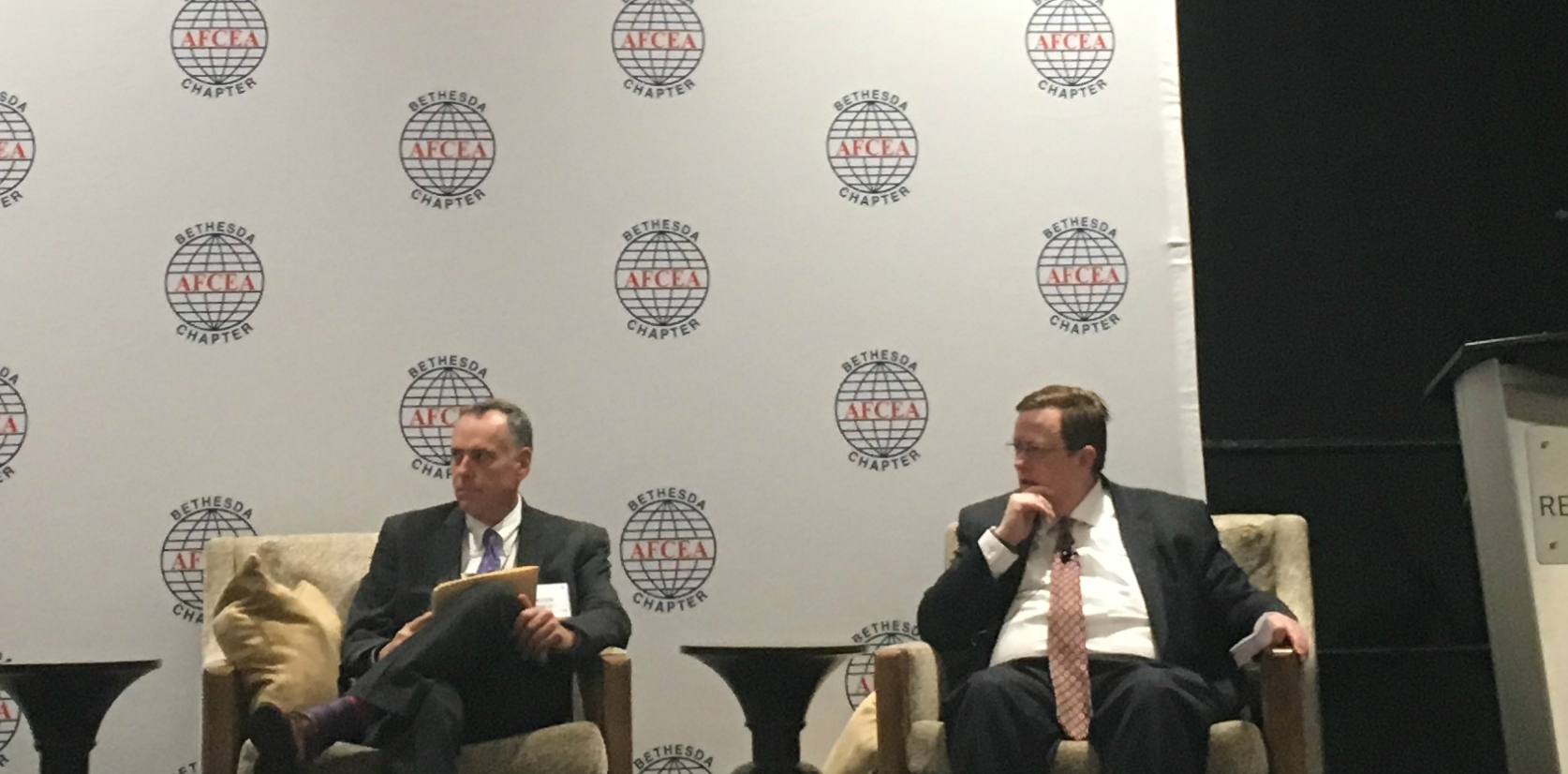 Department of Justice Deputy CIO Kevin Deeley and Department of Homeland Security CIO Luke McCormack speak at an AFCEA Bethesda panel Tuesday. (FedScoop)