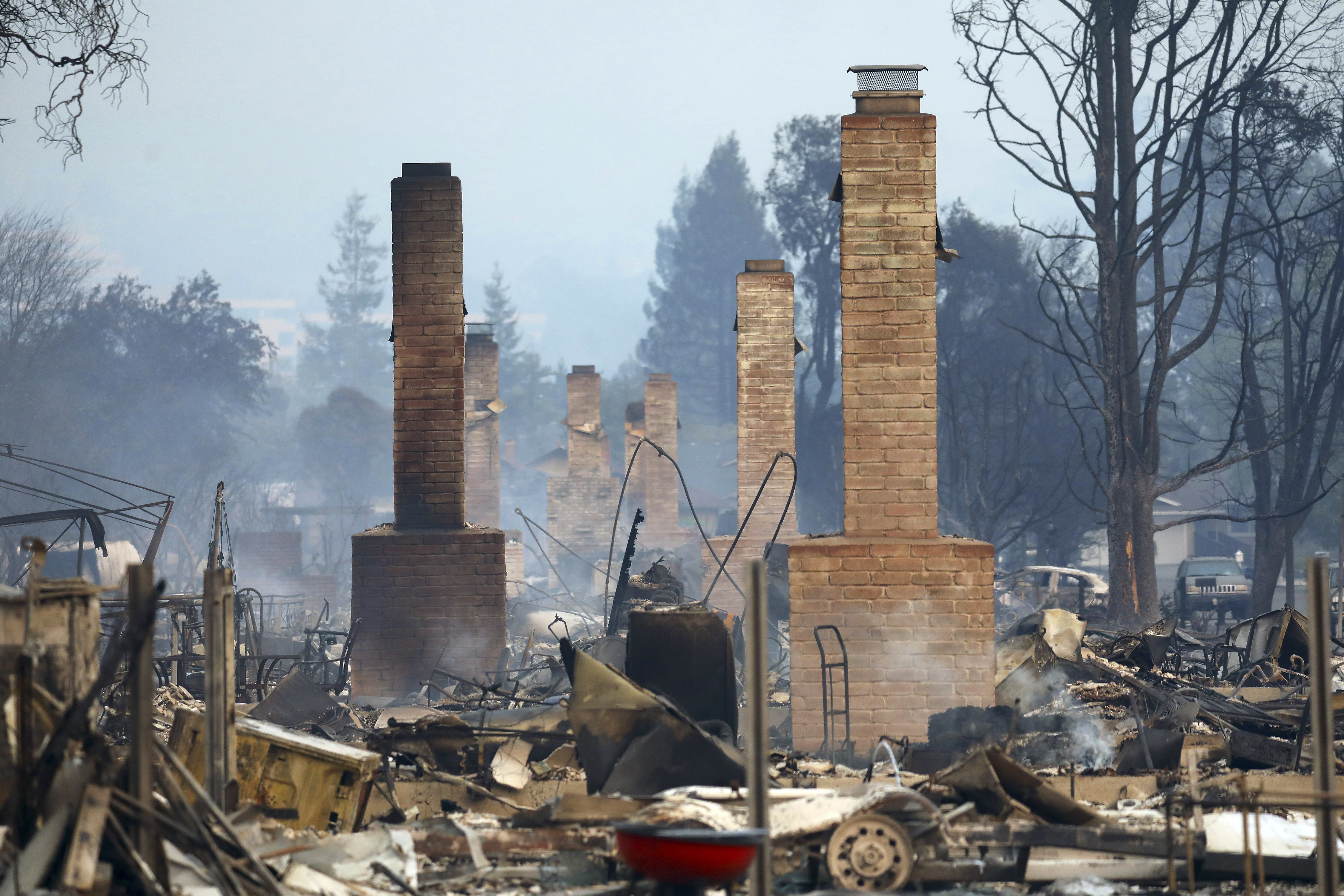 Wildfires force more county courts to postpone trials