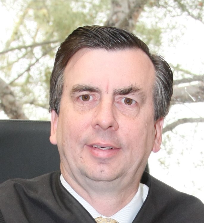 Judge says suspended attorney can remain on ballot for DA