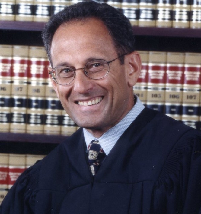 Justice hearing misconduct case against AG candidate blasts both sides