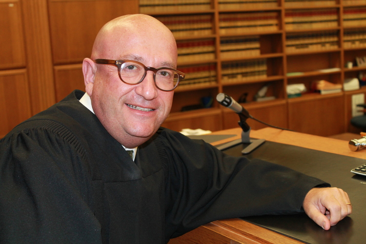 Sued by the plaintiff, judge nevertheless encourages Disney heir to settle $200M trust case